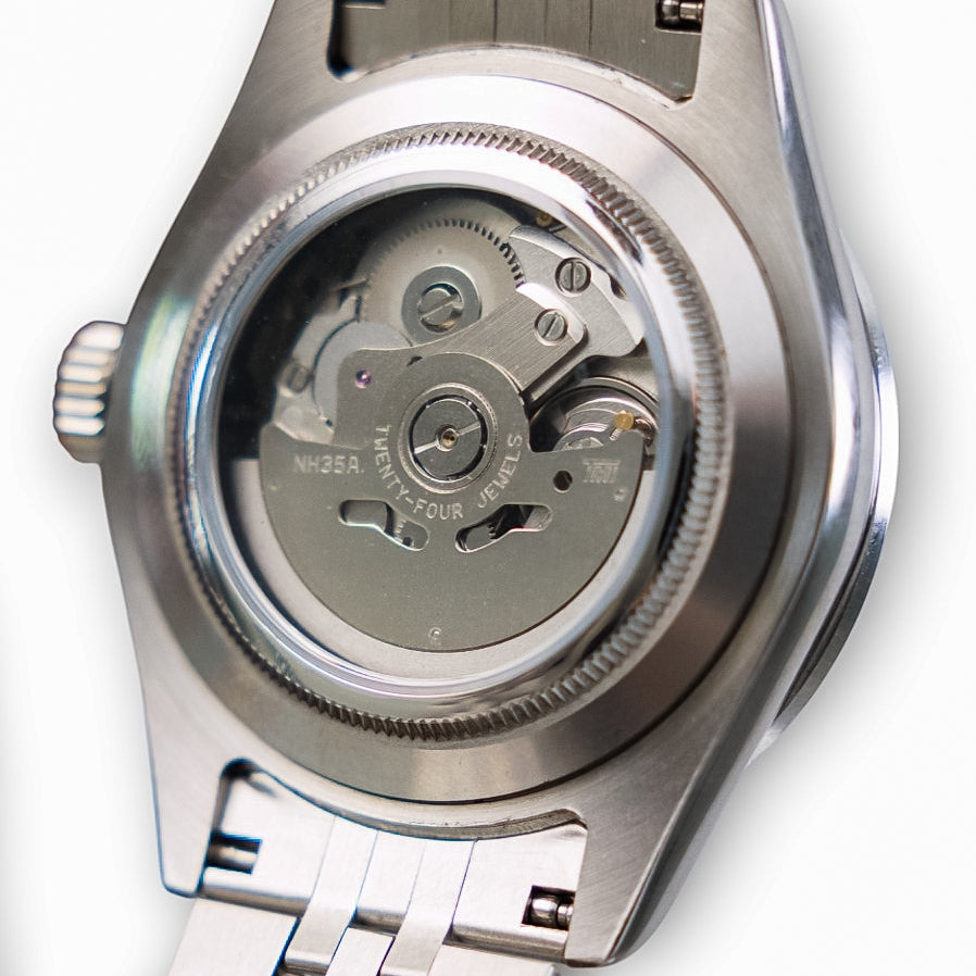 Close-up of a watch automatic mechanism on a white background